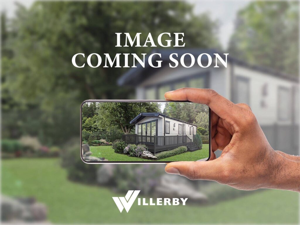 Placeholder - Hand holding phone over a background showing a Holiday Home with text 