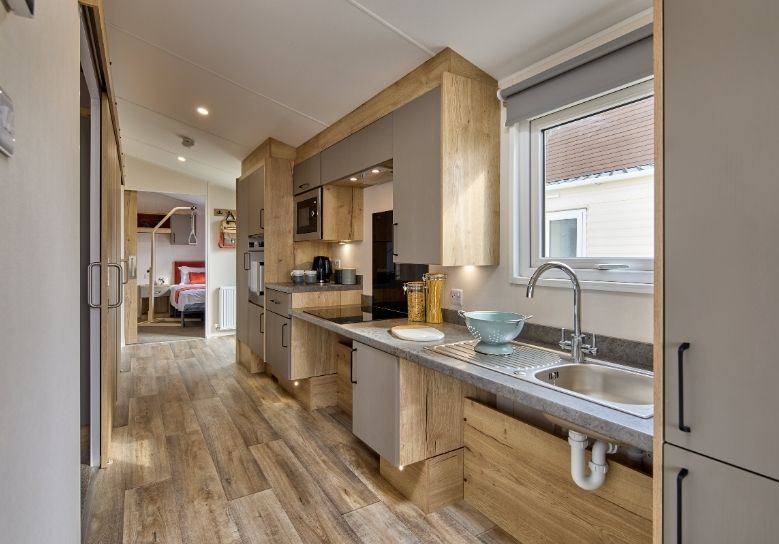 Willerby Rio Access holiday home galley kitchen leading to master bedroom.