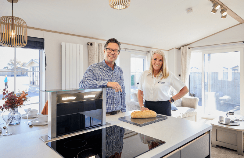 Chief Commercial Officer Darren Black with Southern Counties Leisure Owner and Managing Director, Amanda Keen, at the Vogue kitchen island, which features a space-saving pop-up extractor.