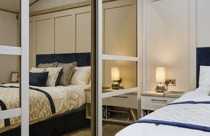 A sliding full-length mirror in the master bedroom conceals both a spacious ensuite bathroom and a walk-in wardrobe.