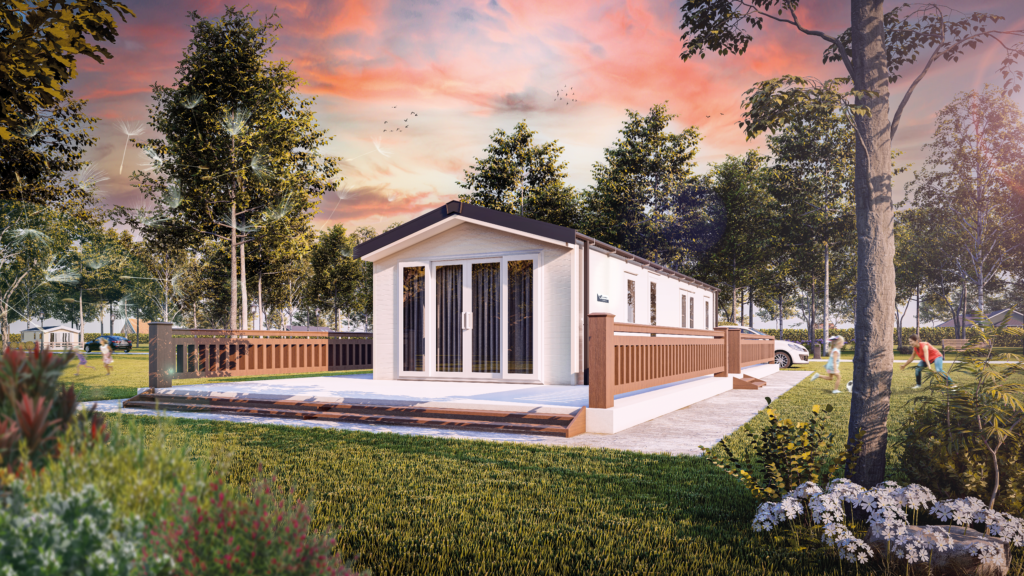 The Willerby Malton, a modern static caravan with white cladding, bi-fold doors, and a raised wooden decking area, set in a wooded plot.